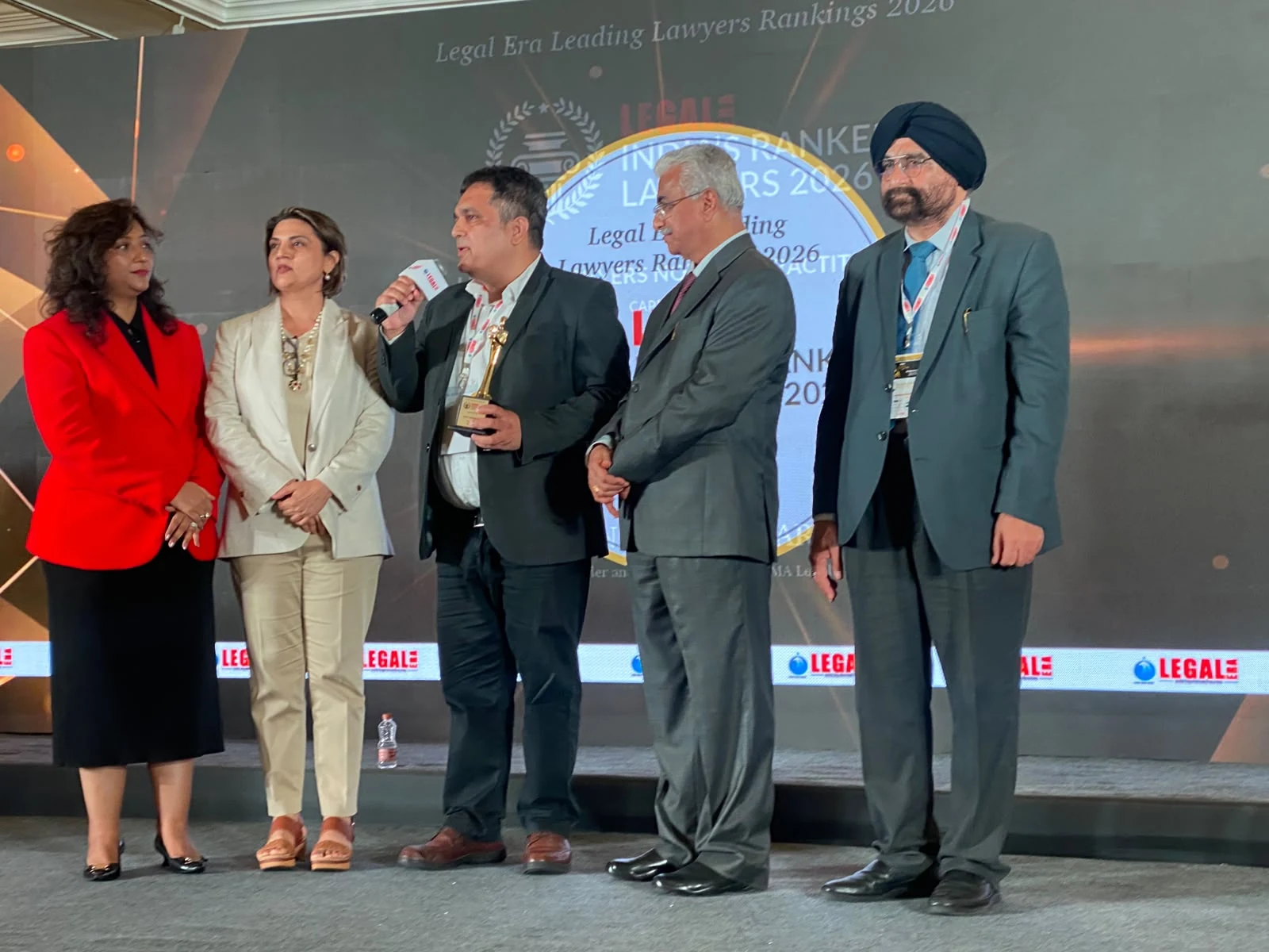 A moment of acknowledgement on stage at the Legal Era ceremony